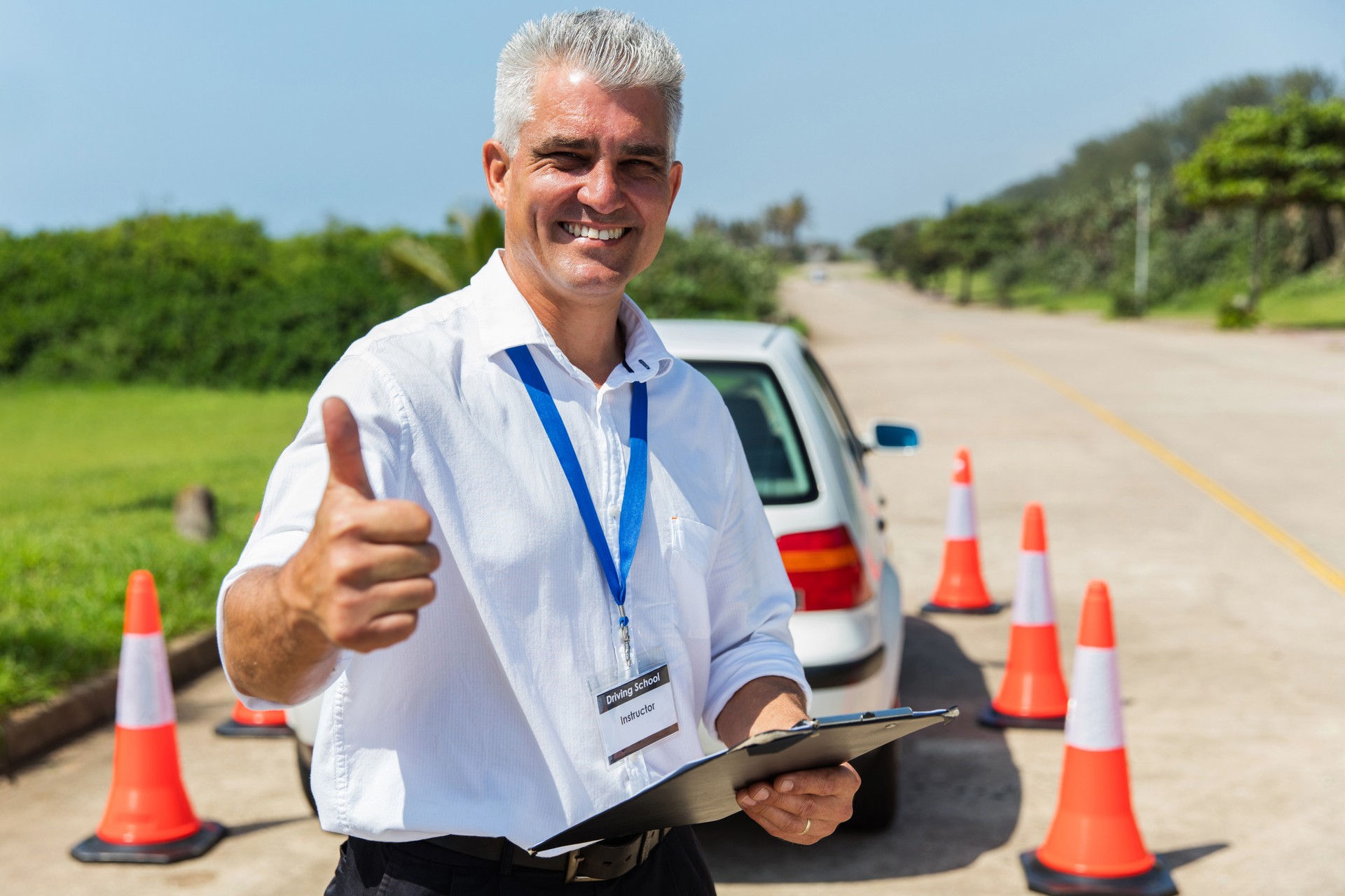 driving school instructor thumb up